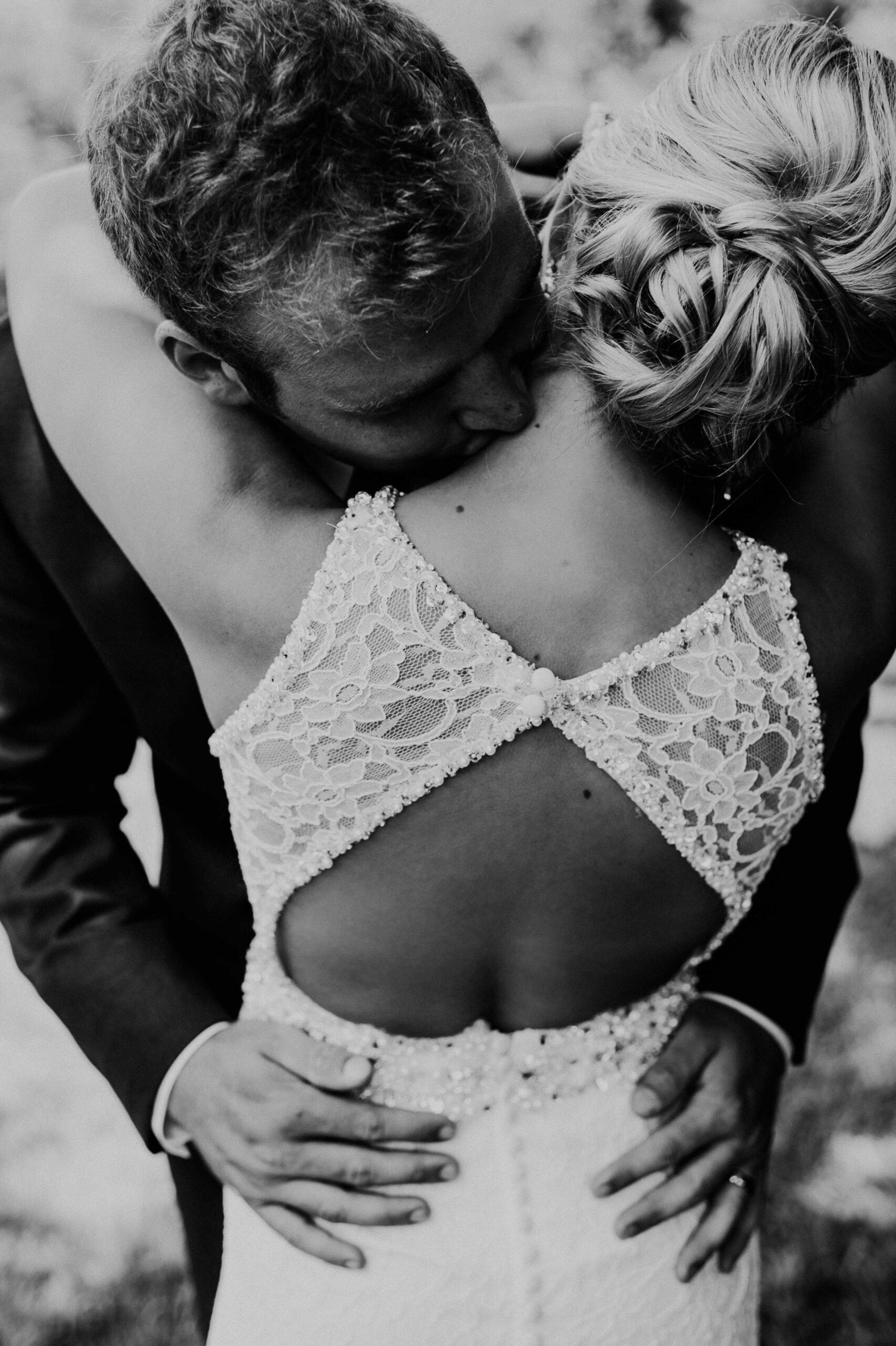 Bride and groom embrace - KMJ family lawyers in London