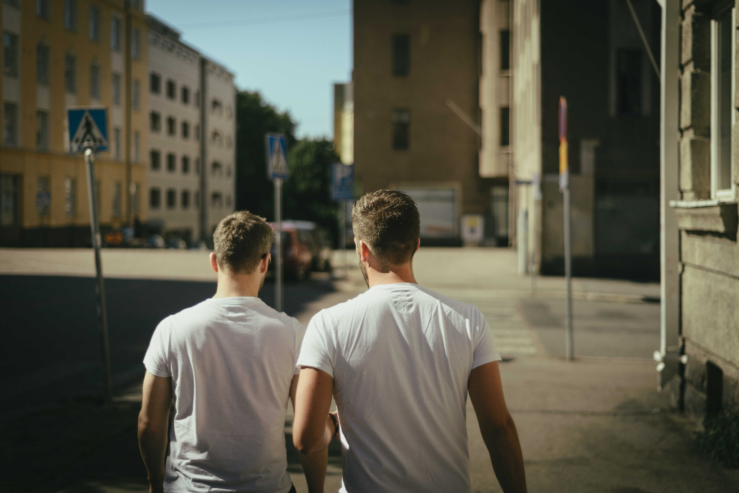 A male couple walking down the road - KMJ divorce lawyers in London