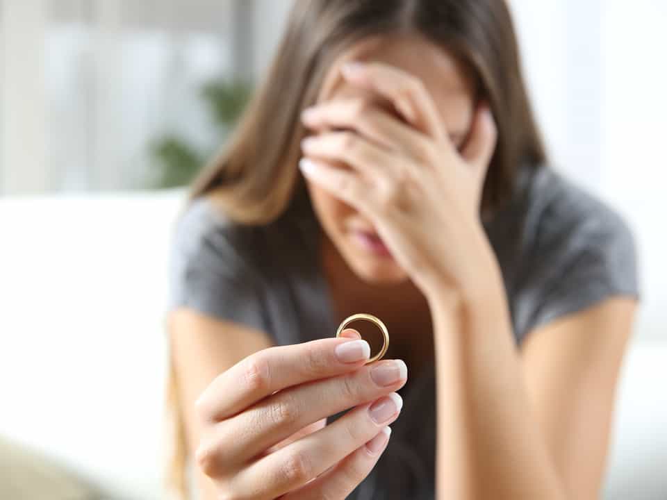 A picture of a sad woman looking for London divorce solicitors
