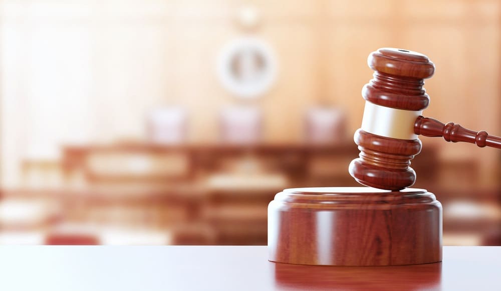 close up of hammer and gavel in a courtroom